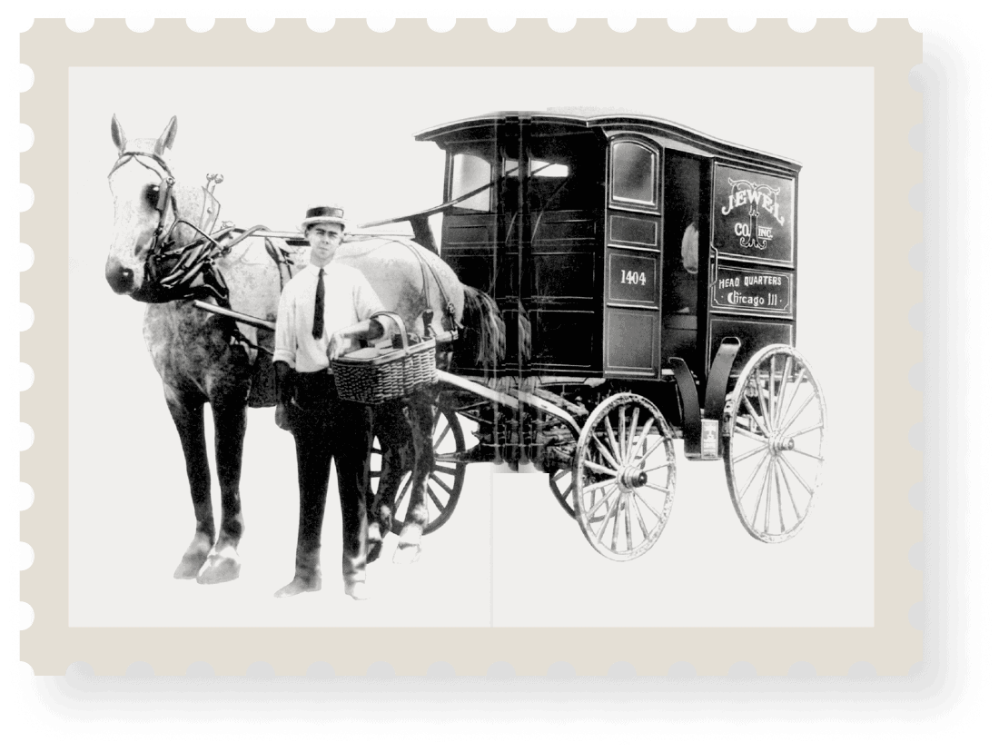 Vintage horse-drawn Jewel Tea Company delivery wagon.