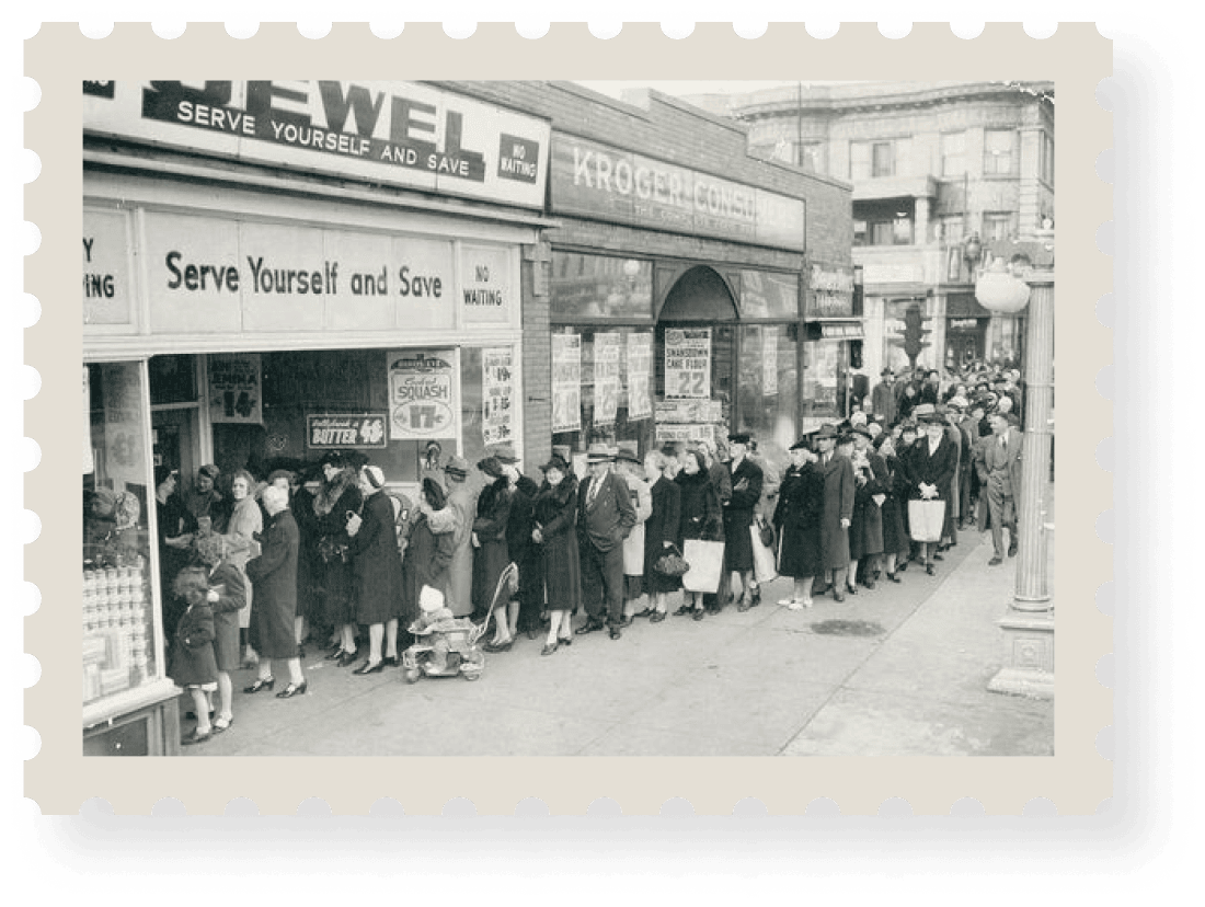 People waiting in line outside grocery store